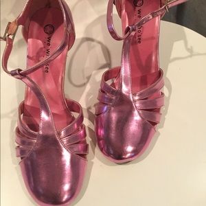 We Who See T-Strap heels in hot pink.
